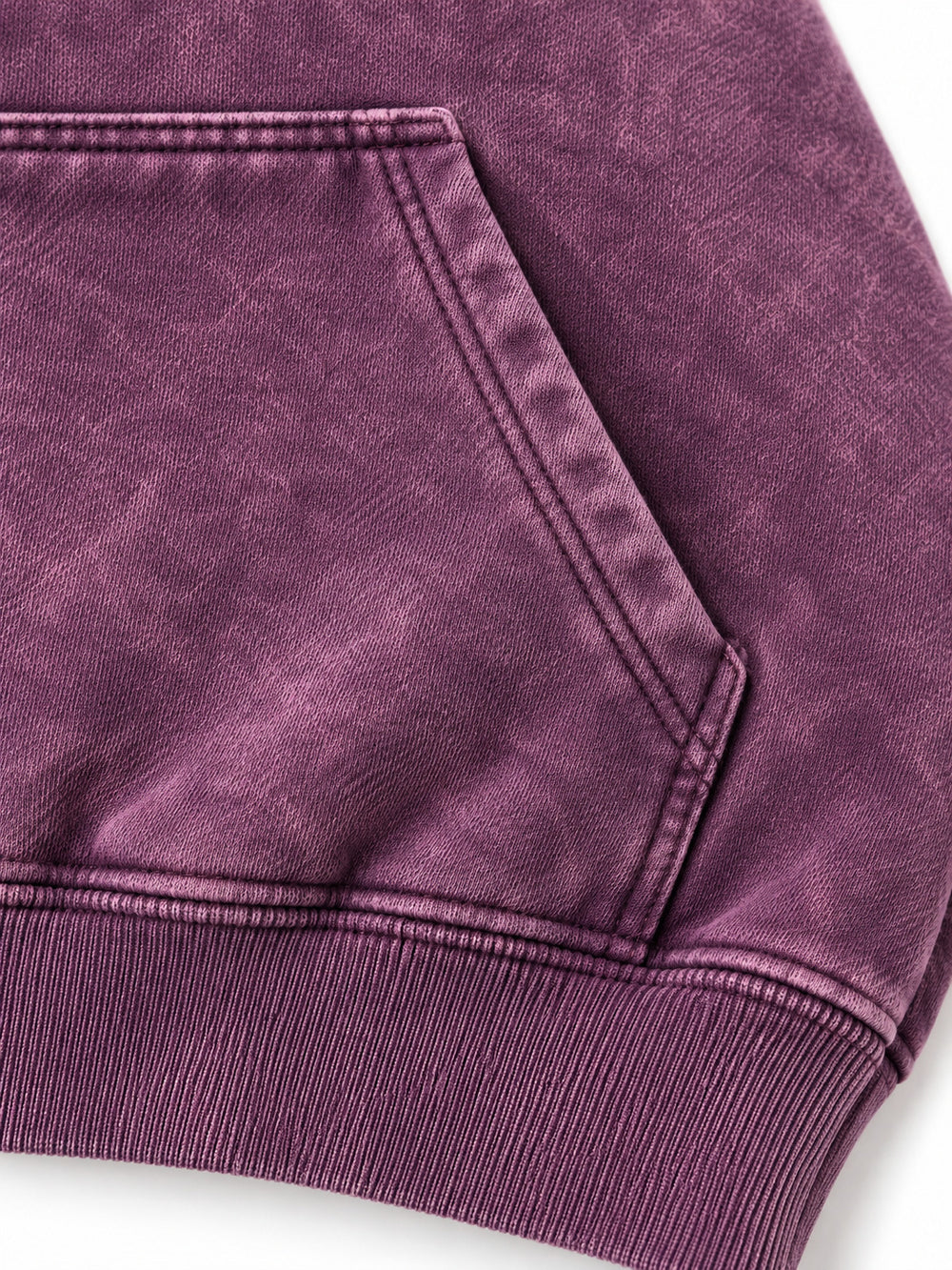 Close-up of the seam stitching of the Cloud Crop plum acid wash cropped hoodie