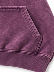 Close-up of the seam stitching of the Cloud Crop plum acid wash cropped hoodie