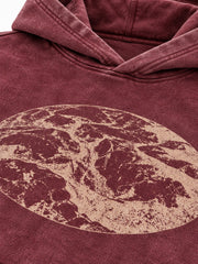 Close-up of the acid wash decoration on the Eroded Terrain burgundy acid wash boxy hoodie