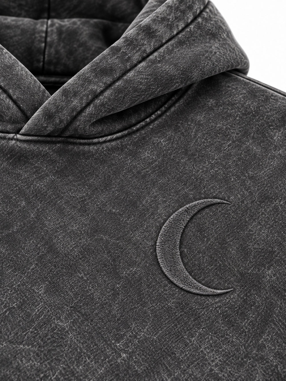 Close-up of the acid wash decoration on the Lunar Ash washed charcoal acid wash boxy hoodie