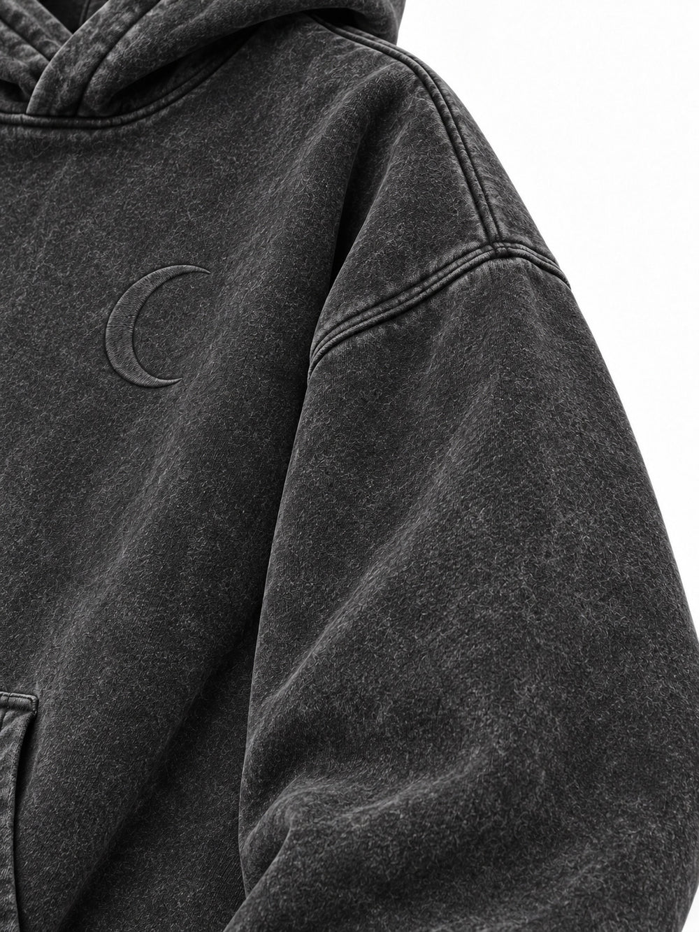 Close-up of the sleeve of the Lunar Ash washed charcoal acid wash boxy hoodie