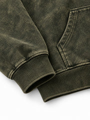 Close-up of the cuff and hem rib of the Olive Fade olive acid wash oversized hoodie