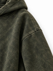 Close-up of the sleeve of the Olive Fade olive acid wash oversized hoodie