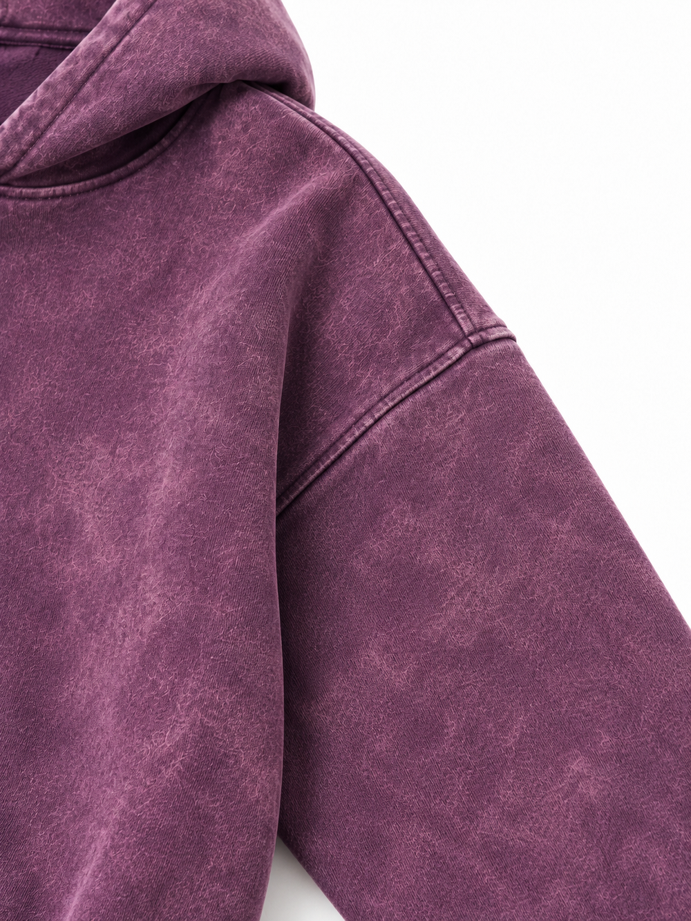 Close-up of the shoulder seam of the Cloud Crop plum acid wash cropped hoodie