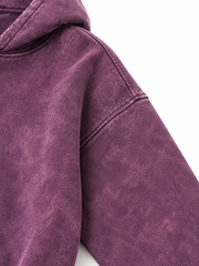 Close-up of the shoulder seam of the Cloud Crop plum acid wash cropped hoodie