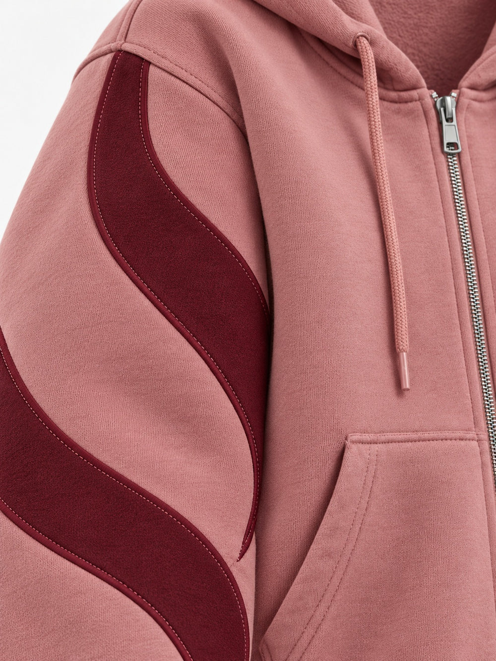 Close-up of the appliqué decoration on the Wave Panel dusty rose appliqué boxy zip-up hoodie