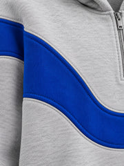 Close-up of the appliqué decoration on the Track Curve ash grey appliqué oversized quarter-zip hoodie