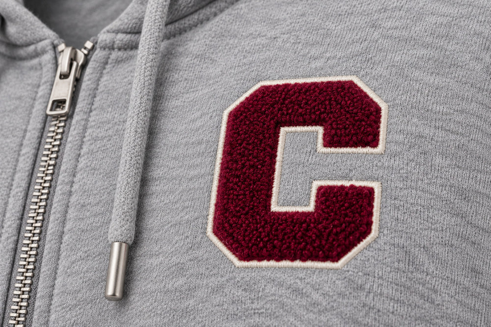 Close-up of the chenille decoration on the Campus Zip heather gray chenille zip-up hoodie
