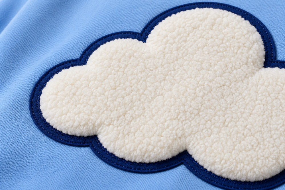 Close-up of the chenille decoration on the Cloud Patch sky blue chenille hoodie