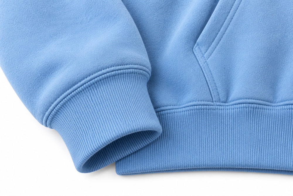 Close-up of the seam stitching of the Cloud Patch sky blue chenille hoodie