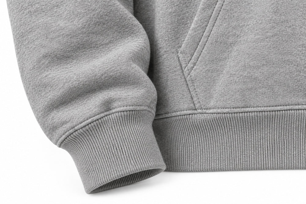 Close-up of the seam stitching of the Club 86 heather gray chenille boxy hoodie
