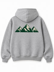 Back view of the Mountain Pile heather grey chenille hoodie with a larger matching mountain-range patch