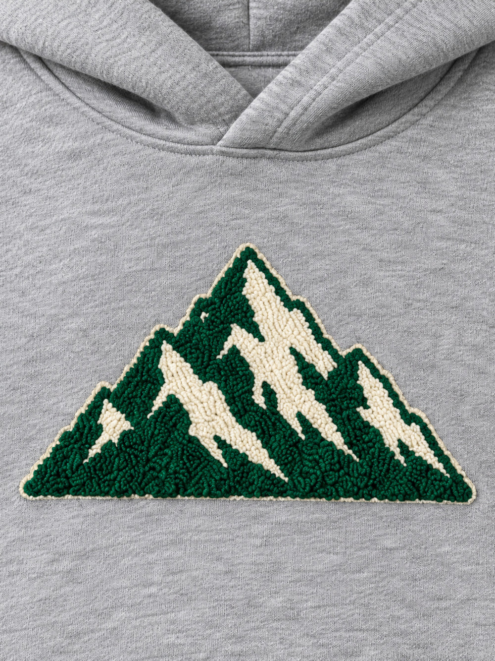 Close-up of the chenille decoration on the Mountain Pile heather grey chenille hoodie