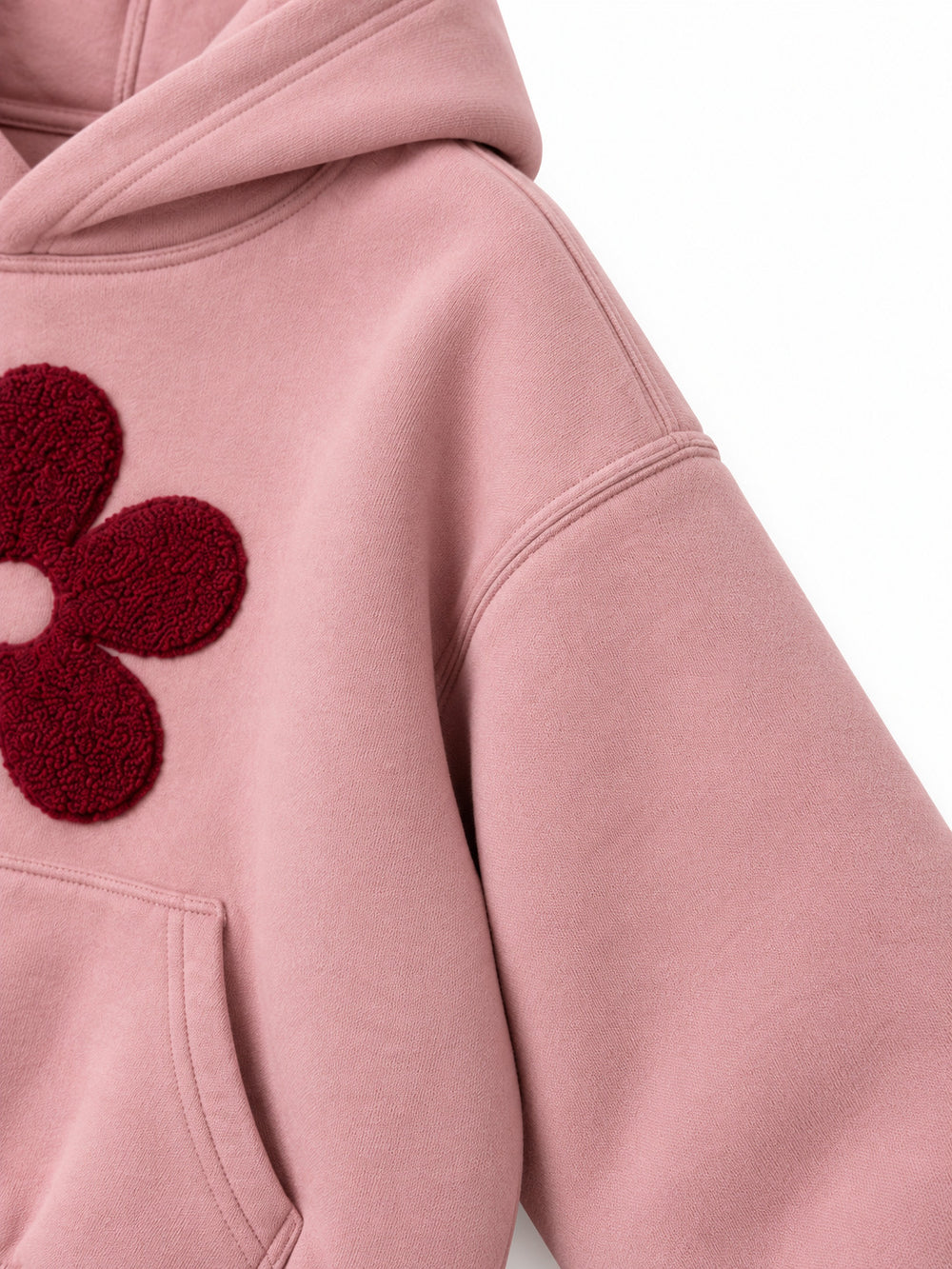 Close-up of the sleeve of the Petal Club dusty pink chenille cropped hoodie