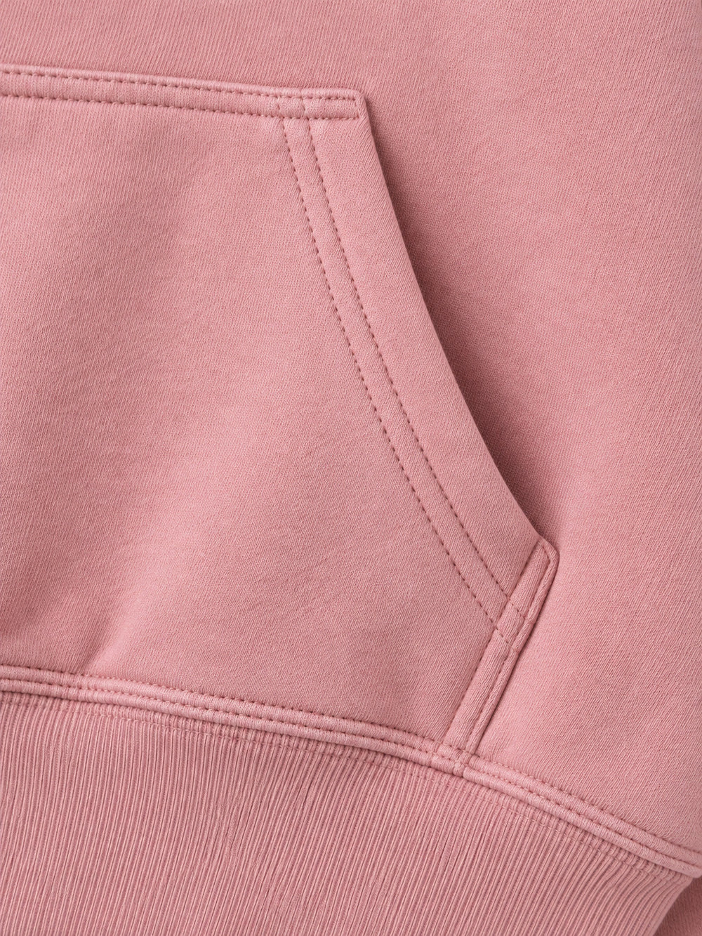 Close-up of the seam stitching of the Petal Club dusty pink chenille cropped hoodie