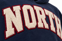 Close-up of the chenille decoration on the Varsity North navy chenille oversized hoodie