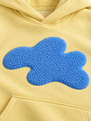 Close-up of the chenille decoration on the Sky Patch butter yellow chenille oversized hoodie