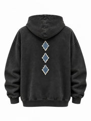 Back view of the Denim Letter washed black denim appliqué oversized hoodie with three small denim diamonds arranged vertically