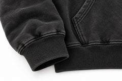 Close-up of the seam stitching of the Denim Letter washed black denim appliqué oversized hoodie