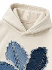 Close-up of the hood and neckline of the Denim Petals cream denim appliqué oversized hoodie