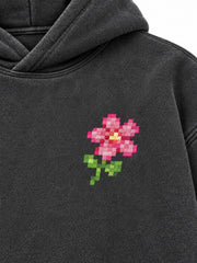 Close-up of the DTF print decoration on the Digital Flora charcoal DTF print oversized hoodie