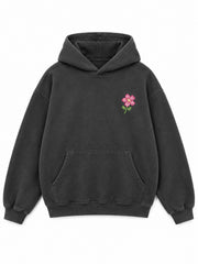 Front view of the Digital Flora charcoal DTF print oversized hoodie with a small pink pixel flower at the left chest