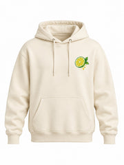 Front view of the Fresh Cut cream DTF print hoodie with small green lemon slice
