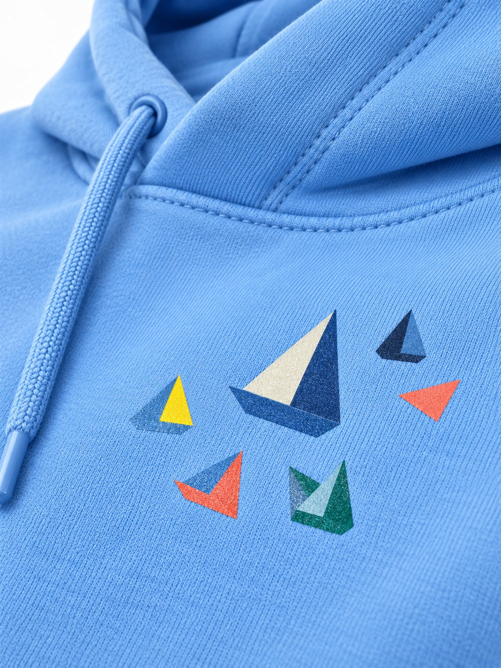 Close-up of the DTF print decoration on the Paper Coast sky blue DTF print hoodie