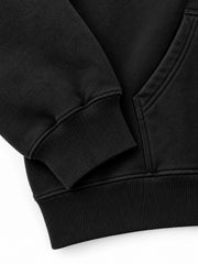 Close-up of the cuff and hem rib of the Prism Bird black DTF print oversized hoodie