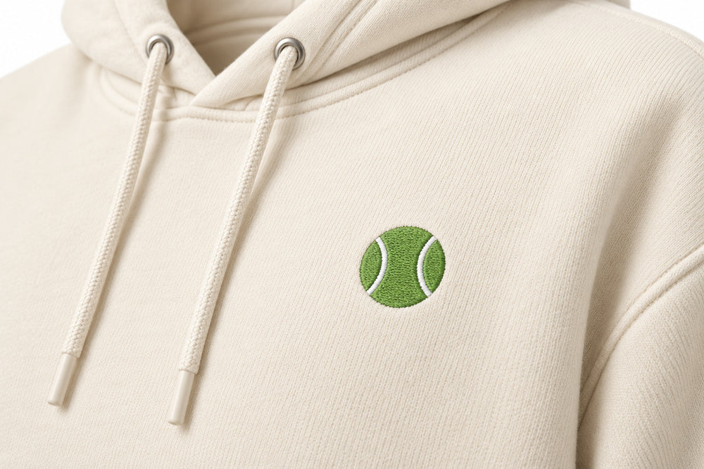 Close-up of the DTF print decoration on the Sunset Tennis ivory DTF print hoodie