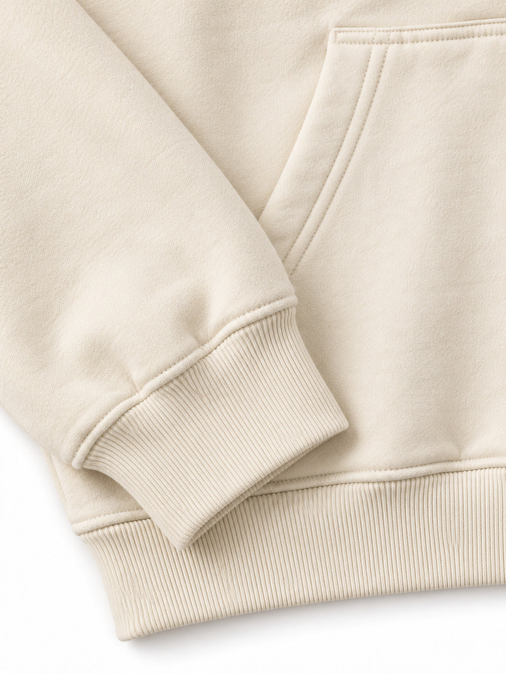 Close-up of the cuff and hem rib of the Alpine Morning ecru DTG print oversized hoodie