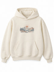 Front view of the Alpine Morning ecru DTG print oversized hoodie with a small sunrise and mountain illustration