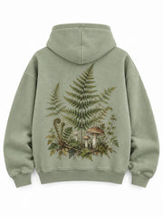 Back view of the Botanical Archive sage DTG print hoodie with a detailed woodland arrangement of fern leaves and mushrooms