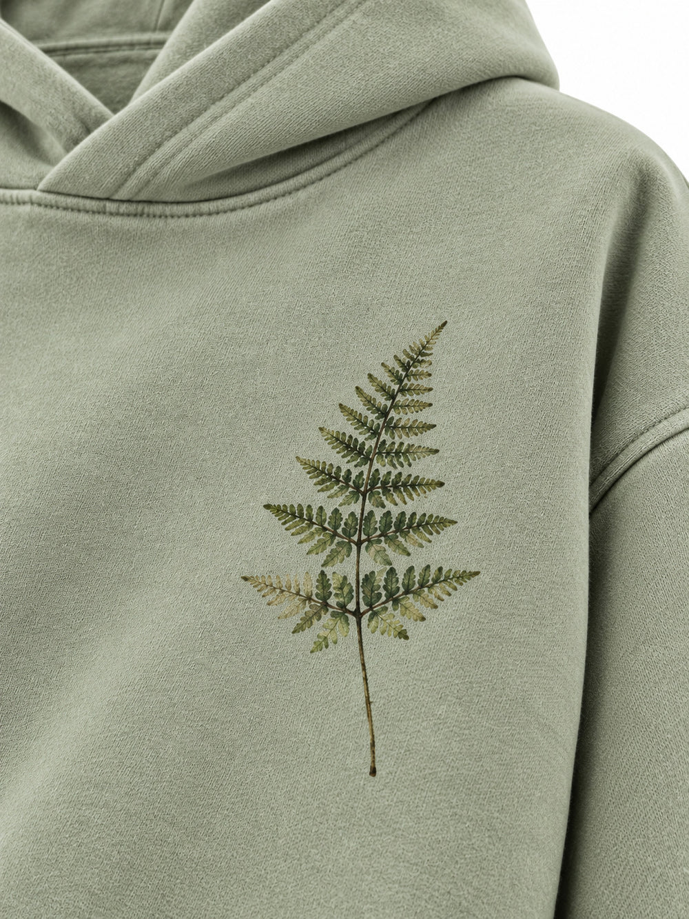 Close-up of the DTG print decoration on the Botanical Archive sage DTG print hoodie
