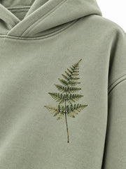 Close-up of the DTG print decoration on the Botanical Archive sage DTG print hoodie