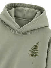 Close-up of the hood and neckline of the Botanical Archive sage DTG print hoodie