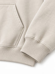 Close-up of the cuff and hem rib of the Coastal Study light stone DTG print hoodie