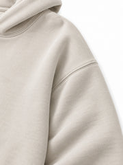 Close-up of the sleeve of the Coastal Study light stone DTG print hoodie