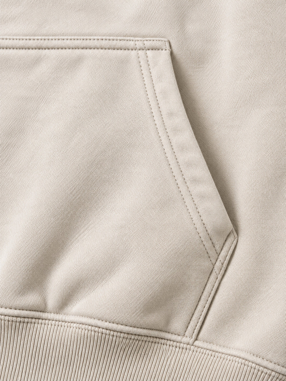 Close-up of the seam stitching of the Coastal Study light stone DTG print hoodie