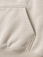 Close-up of the seam stitching of the Coastal Study light stone DTG print hoodie