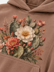Close-up of the DTG print decoration on the Cactus Garden clay DTG print oversized hoodie