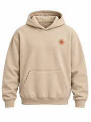 Front view of the Desert Echo sand DTG print boxy hoodie with tiny terracotta desert sun emblem
