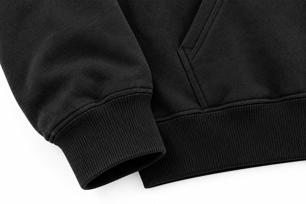 Close-up of the seam stitching of the Lunar Voyage black DTG print oversized hoodie