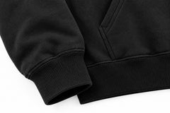 Close-up of the seam stitching of the Lunar Voyage black DTG print oversized hoodie