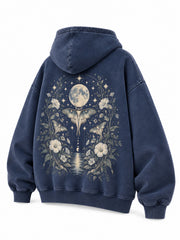 Rear three-quarter view of the Moon Garden washed indigo DTG print oversized hoodie