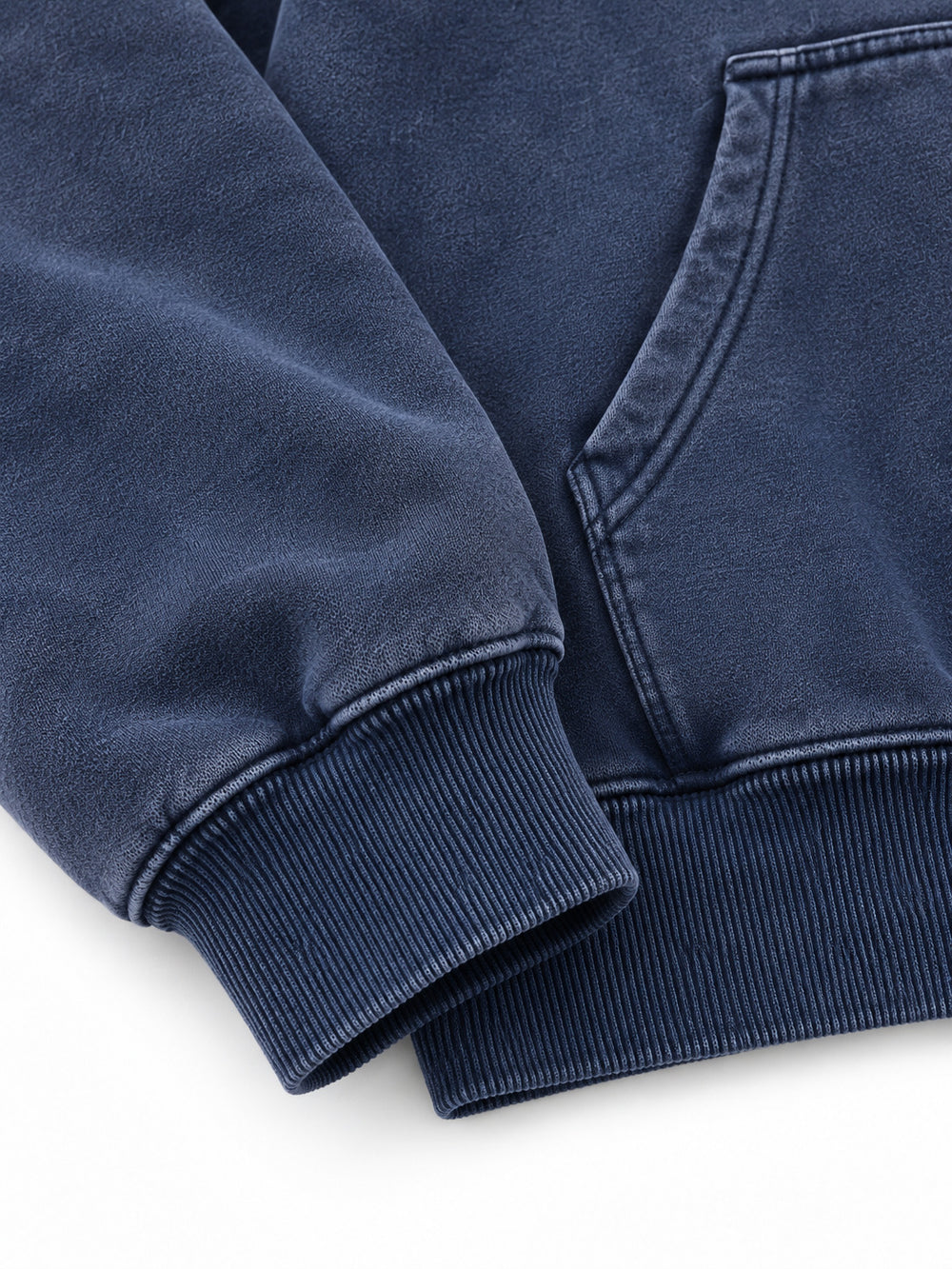 Close-up of the cuff and hem rib of the Moon Garden washed indigo DTG print oversized hoodie