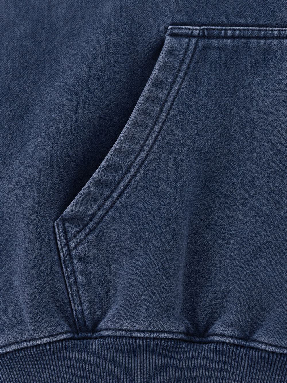 Close-up of the seam stitching of the Moon Garden washed indigo DTG print oversized hoodie