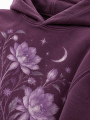 Close-up of the DTG print decoration on the Nocturne Flora plum DTG print boxy hoodie