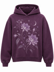 Front view of the Nocturne Flora plum DTG print boxy hoodie with moonlit lilac flowers, stars and a crescent moon across the chest
