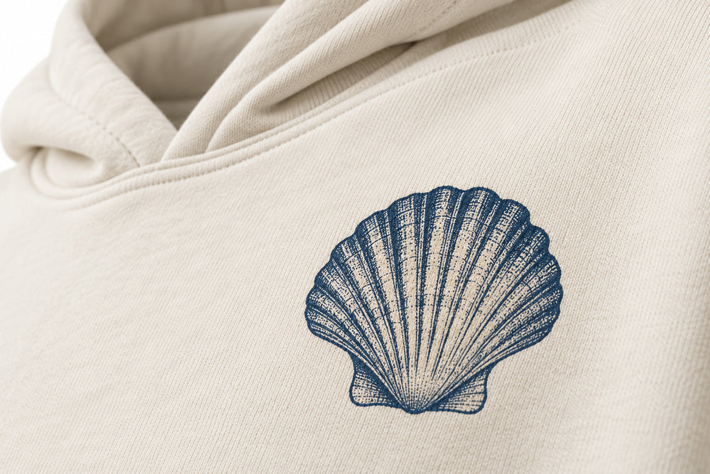 Close-up of the DTG print decoration on the Ocean Archive bone DTG print hoodie